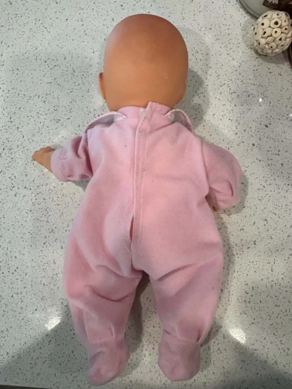 Soft Body Baby Doll with Vinyl Head and Pink Animal Applique Bib